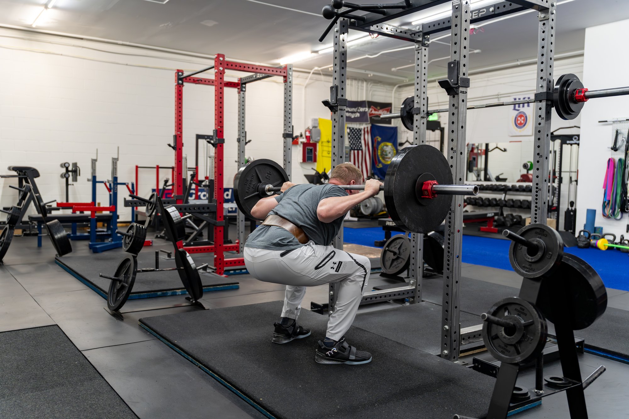 The training floor at Ground Zero Strength with a member lifting